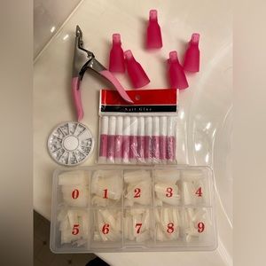 Nail tips, cutter, glue, gems & 5 polish remove clips